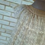 پیراهن دخترانه مجلسی شیری با یقه گرد چین‌دار و آستین کوتاه